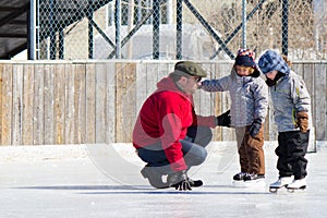 Family having fun at the skating rink