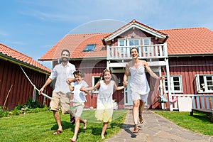 Family having fun with their new home or house