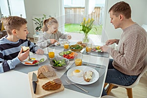 Family having healthy breakfast at home