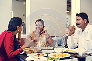 Family having Indian food together