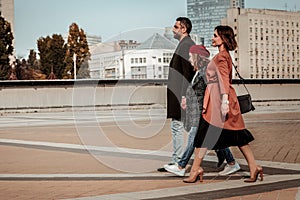 Family having a jaunt in the center of the city