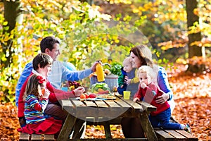 Family having picnic in autumn