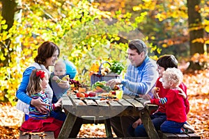 Family having picnic in autumn