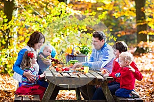 Family having picnic in autumn