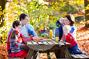 Family having picnic in autumn