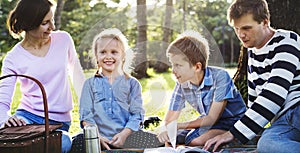 Family having a picnic in the park