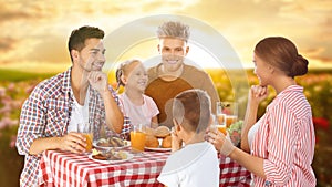 Family having picnic at table in garden