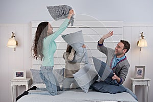 Family having pillow fight