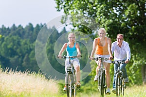 Family having weekend bicycle tour outdoors