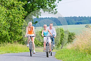 Family having weekend bicycle tour outdoors