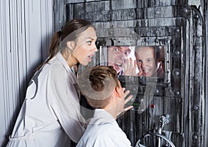 Family is helping dad and girl get out of the locked door