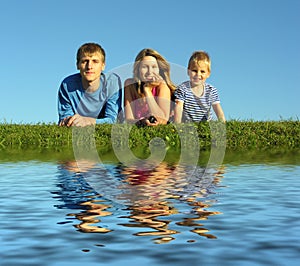 Family on herb with water