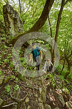 Family of hikers walking on a mountain trail