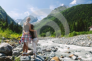 Family hikers walking to mountains