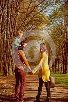 Family on hiking adventure through forest. Father give child piggyback ride on hiking path. Its a real pleasure