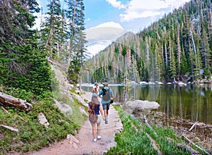 Family hiking in Colorado  mountains.