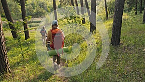 Family hiking through a forest