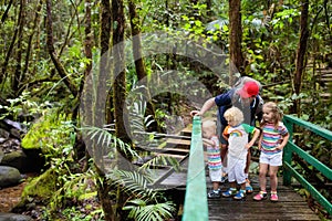 Family hiking in jungle.