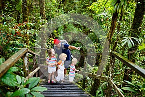 Family hiking in jungle.