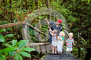 Family hiking in jungle.