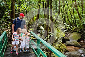 Family hiking in jungle.