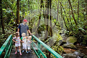 Family hiking in jungle