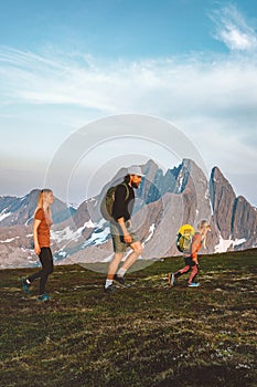 Family hiking in mountains outdoor parents and child together traveling in Norway healthy lifestyle adventure vacations