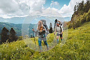 Family hiking in mountains travel adventure vacations group hikers