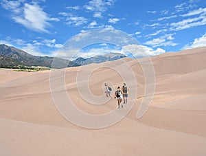 Family hiking in the mountains on vacation trip.