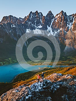 Family hiking in northern Norway sunset mountains and fjord aerial view active healthy lifestyle summer vacations
