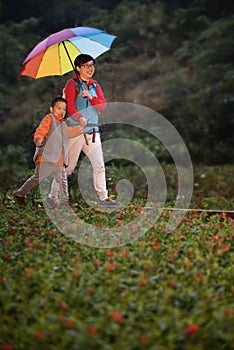 Family hiking in rain