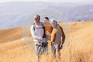 Family hiking together in the autumn