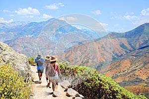 Family on hiking trip in high mountains.