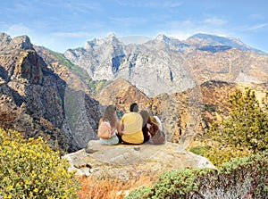 Family on hiking trip in high mountains.