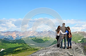 Family on hiking trip in Rocky Mountains .