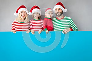 Family holding cardboard banner blank