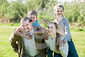 family holding girl and boy