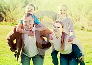 Family holding girl and boy