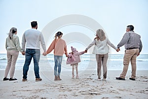 Family holding hands, beach and adventure with love, trust and relationship, outdoor bonding by the ocean. Parents