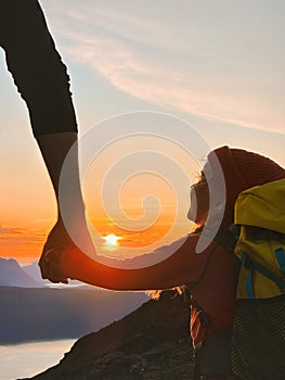 Family holding hands child and parent hiking in sunset mountains travel together adventure healthy lifestyle outdoor