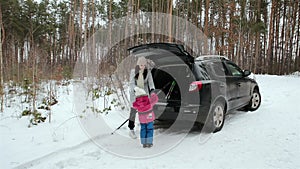 Family holiday in the winter forest.