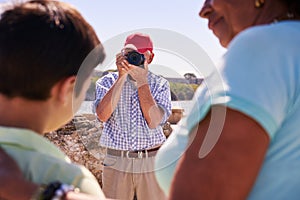 Family On Holidays In Cuba Grandpa Tourist Taking Photo