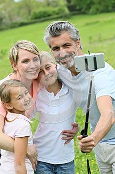 Family on holidays taking selfie