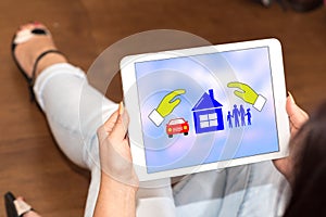 Family, home and car insurance concept on a tablet