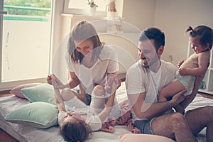 Family at home. Cheerful family having fun with their daughter.