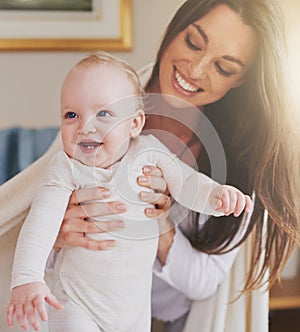 Family, home and mother playing with baby for bonding, relationship and care for motherhood. Love, parenting and happy