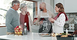 Family, home and wine glasses for toast with holiday celebration, thanksgiving and hug or talking in kitchen. Happy