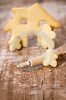 Family and house cookies on wooden table, concept planning and baking a homestead photo