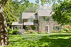 Family house with front lawn on sunny spring day