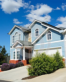 Family house over blue sky